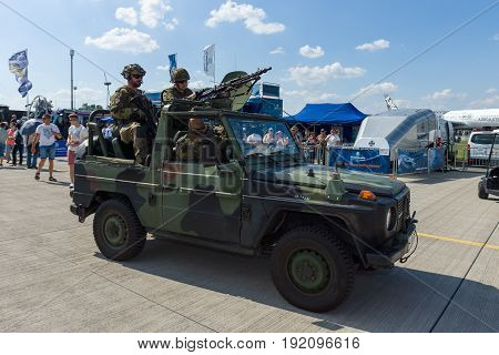 BERLIN GERMANY - JUNE 03 2016: Soldiers and officers of the German army (Bundeswehr) in the car. Exhibition ILA Berlin Air Show 2016