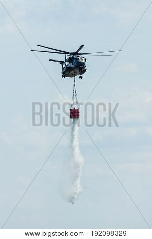BERLIN GERMANY - JUNE 03 2016: Flight helicopter NH90 of the German Army with equipment for fighting fires. Exhibition ILA Berlin Air Show 2016