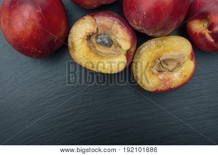 Ripe Nectarine On Black Background Of Slate Or Stone