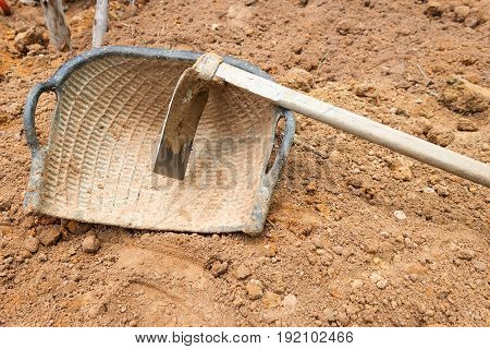 industry consrtuction site work hoe and basket on ground