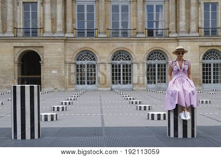 Paris, France, June 16, 2017 : A Tourist Woman Sits In The Larger Inner Courtyard Of Palais-royal, T