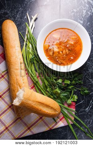 Vegetables And Meat In Red Beetroot Soup Or Borsch In White Plate On Dark Marble Background.