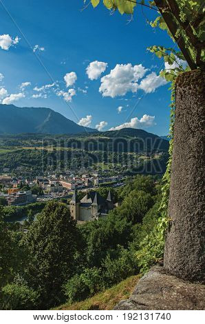Conflans, France - June 29, 2016. View of valley and building below the city center of Conflans, a medieval hamlet located in Haute-Savoie department, Auvergne-Rhône-Alpes region, south-eastern France