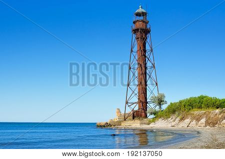Old Lighthouse On The Beach Near The Sea. Lighthouse On The Coast Of The Island Dzharylgach.