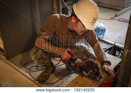 US Navy Seabees help Habitat for Humanity NYC on a housing building project in Brooklyn during Fleet Week New York, celebrating Sea Services and 75th anniversary of the Seabees, NEW YORK MAY 25 2017.