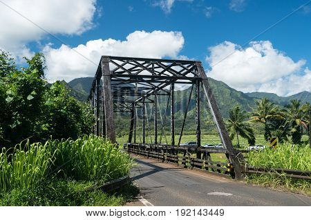 Old metal girder and wood bridge on the road to Hanalei from Princeville in Kauai, Hawaii