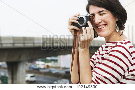 Woman traveler photographer holiday lifestyle trip