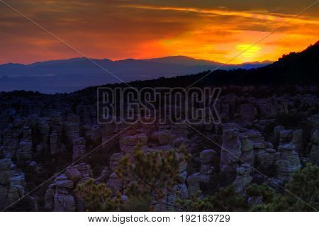 Mountain Sunset with Purple Hills and Orange Sky