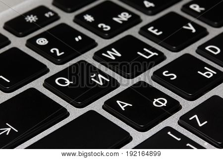 Russian and English letters on the computer keyboard