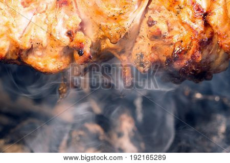 Lamb meat kebab prepares on the fire outdoors