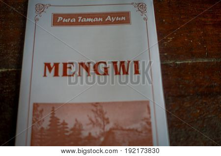 BALI, INDONESIA - MARCH 08, 2017: Informative sign of the Royal temple of Mengwi Empire located in Mengwi in Bali, Indonesia.