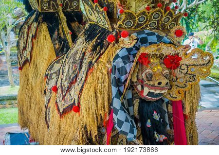 BALI, INDONESIA - MARCH 08, 2017: Typical balinese costumes made of grains of rice, beans and corns inside of the Royal temple of Mengwi Empire located in Mengwi in Bali, Indonesia.