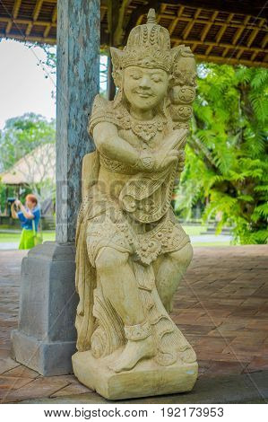 BALI, INDONESIA - MARCH 08, 2017: Beautiful stone statue inside of the Royal temple of Mengwi Empire located in Mengwi in Bali, Indonesia.
