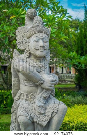 BALI, INDONESIA - MARCH 08, 2017: Beautiful stone statue inside of the Royal temple of Mengwi Empire located in Mengwi in Bali, Indonesia.