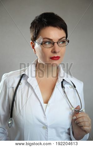 Portrait of a beautiful and sexy female doctor in a hospital