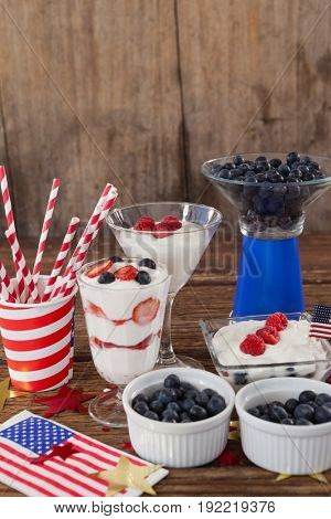 Fruits and ice cream with 4th july theme arranged on table