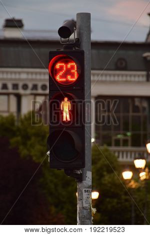 In 23 seconds you can cross the street - A red traffic light and a signal light indicating when it will turn on green