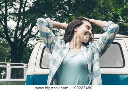woman injoy her trip on van even in rainy weather