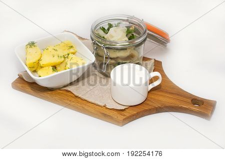 Sugudai from omul fish from Baikal with potatoes on white background