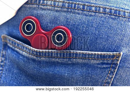 Keep fidget spinner at jeans pocket. Popular spinner gadget in 2017.