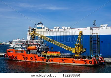 Labuan,Malaysia-June 15,2017:Platform supply vessel (PSV) offshore support vessel,ready to the offshore oil production fields from port at Labuan,Malaysia on 15th June 2017