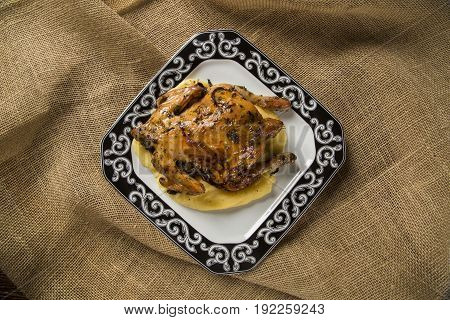 Little Chicken Dish With Polenta On Wood Background