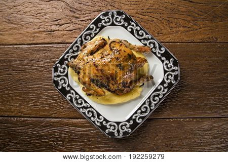 Little Chicken Dish With Polenta On Wood Background