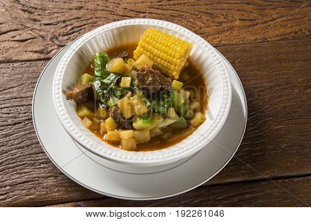 South American Cuisine: Puchero Soup With Chickpeas Close-up In A Pot On The Table.