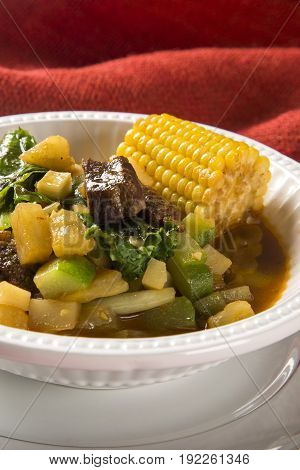 South American Cuisine: Puchero Soup With Chickpeas Close-up In A Pot On The Table.