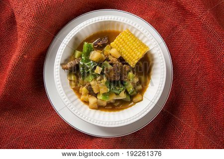 South American Cuisine: Puchero Soup With Chickpeas Close-up In A Pot On The Table.