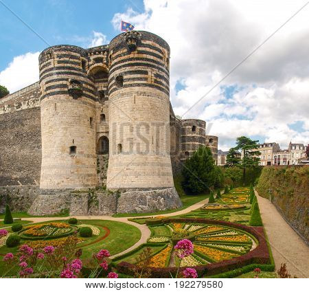 Angers France - June 10, 2014: Chateau d'Angers. View of the walls of the castle and gardens around