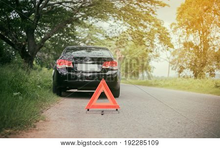 A car breakdown with Red triangle of a car on the road