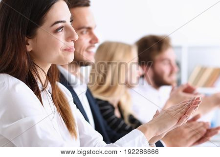 A Group Of People At The Seminar Applauded The Lecturer In The Palm Of Their Hand