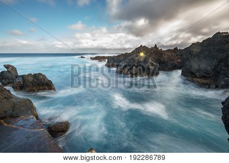 Wide angle long exposure of Biscoitos with volcanic rocks in Terceira Island, Portugal