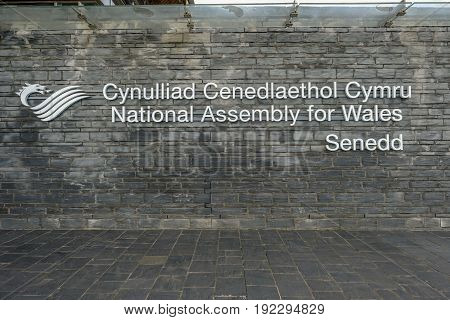 Cardiff Bay Cardiff Wales - May 20 2017: View of National Assembly signage Senedd in Welsh and English.