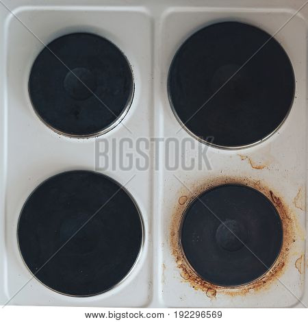 electric cooker dirty pancakes with rust and grease.
