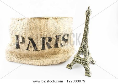 Eiffel tower and '' Paris '' written on a cloth. White background.