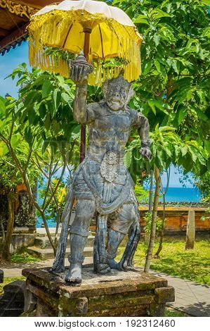 BALI, INDONESIA - MARCH 05, 2017: Stoned statue of king monkey in the enter of Pura Ulun Danu Bratan temple on Bali island, Indonesia.