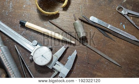 Jewelry making tool,Tools, components and finished mold lie on a bench in the handcraft.