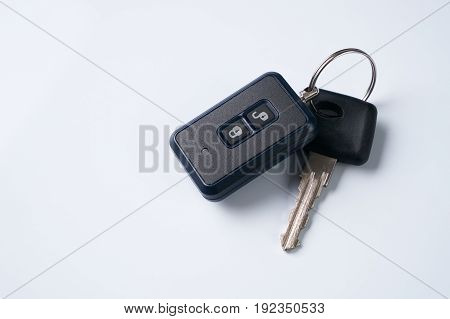 Car key and alarm system charm isolated on a white background with copy spase. car key with remote control