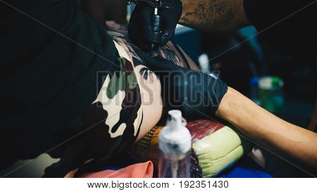 Tattoo Artist Drawing Art On Body