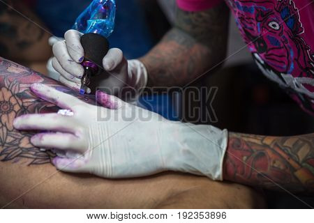 Tattoo Artist Drawing Art On Body