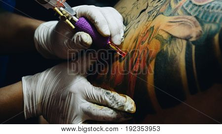Tattoo Artist Drawing Art On Body