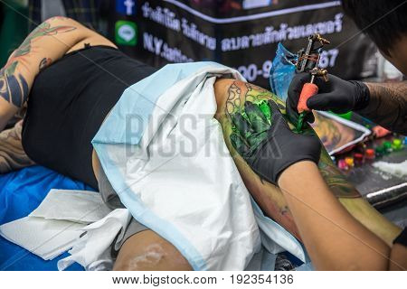 Tattoo Artist Drawing Art On Body