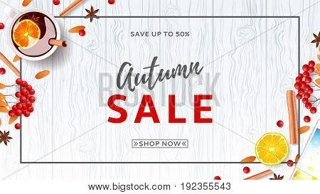 Beautiful web banner for autumn sale. Top view on composition with cup of mulled wine, rowan, cinnamon sticks on wooden texture. Vector illustration.