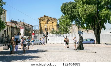 Tourists On Square Place Des Arenes In Nimes