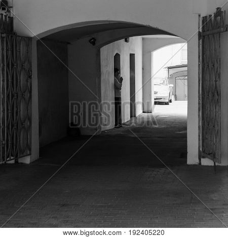 Man In Gateway On Valnu Iela Street
