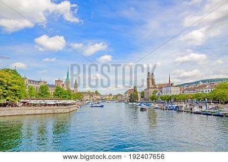 Panoramic view of historic Zurich city center with famous Grossmunster Fraumunster St. Peter church and river Limmat at Lake Zurich on a sunny day with clouds in summer Canton of Zurich Switzerland