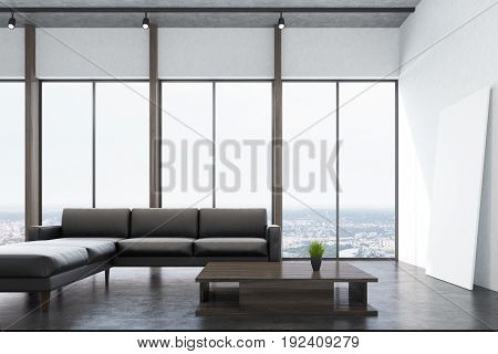 White living room interio with a concrete floor panoramic windows a fireplace a long gray sofa and a narrow coffee table. 3d rendering mock up