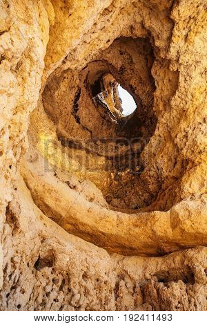Hole In Eroded Sandstone Rock Near Albufeira